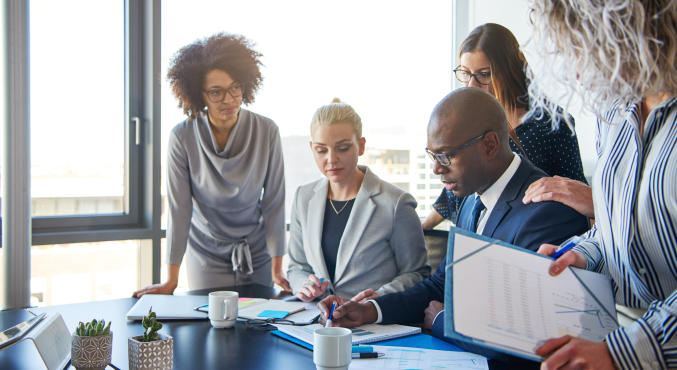 A group of people reviewing documents 