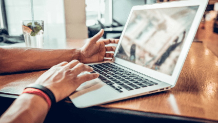 Team member accessing digital data on laptop